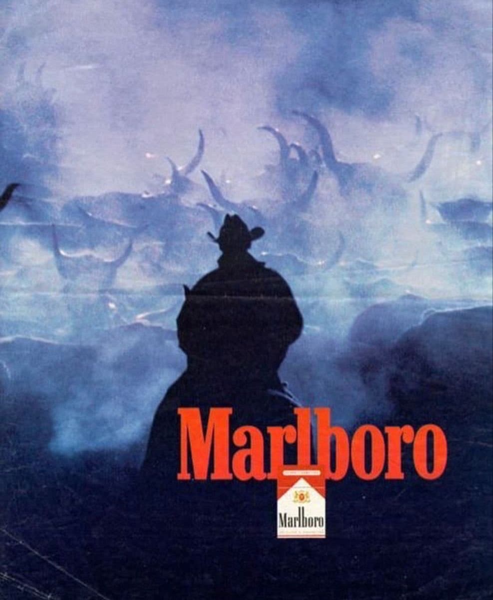 Marlboro ad with cowboy silhouette.